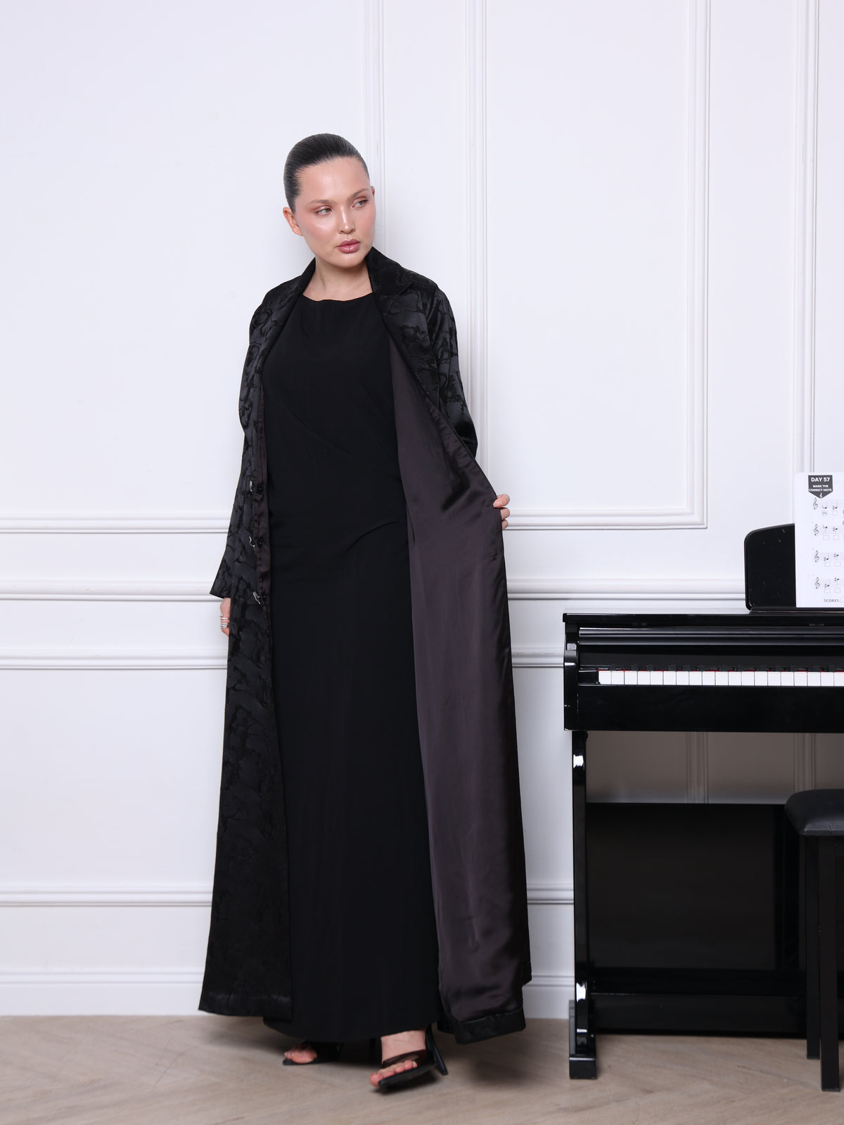Close-up of textured black jacquard fabric on The Majestic Veil abaya