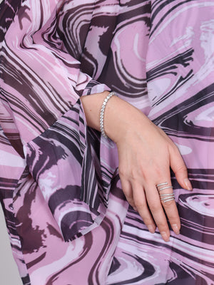 Close-up of the wave sleeves  inspired print on The Wave pink abaya