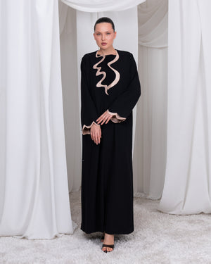 The Sovereign Flow luxury black abaya with signature architectural beige trim by Le Marque Closet